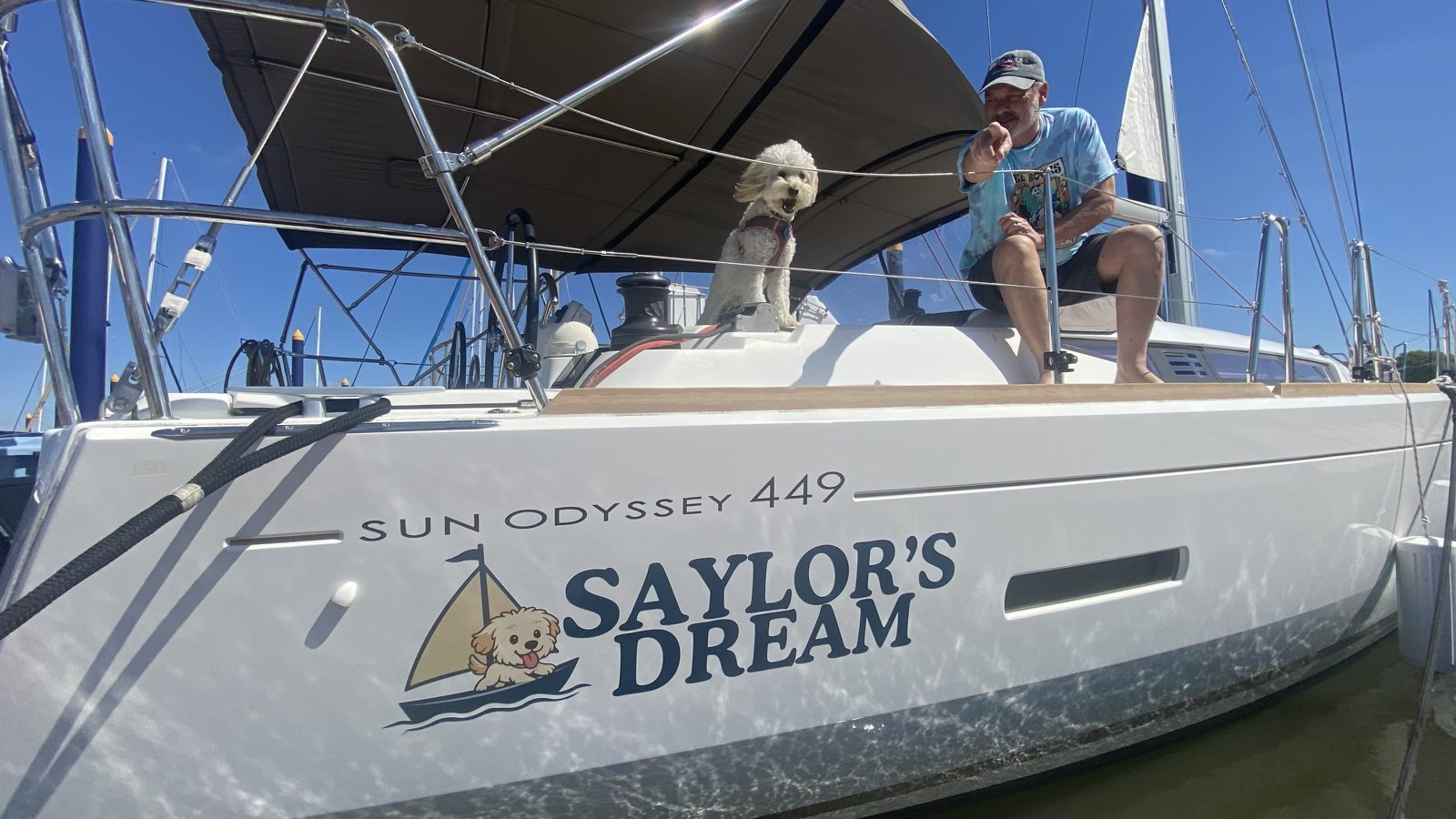 Saylor's Dream, a Jeanneau Sun Odyssey 449, with her owner and ship's dog on deck