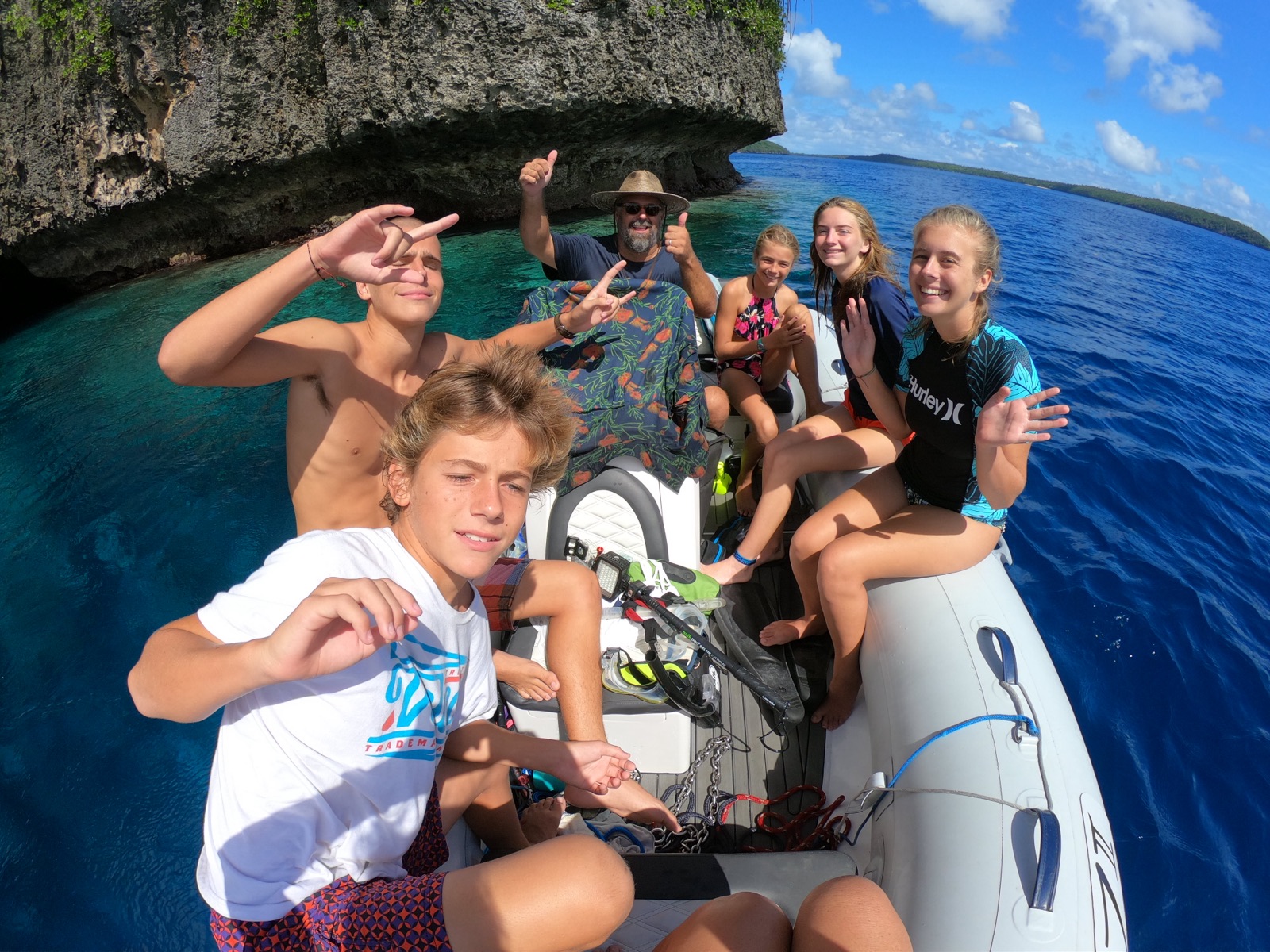 The Zatara family on the dinghy off a tropical island