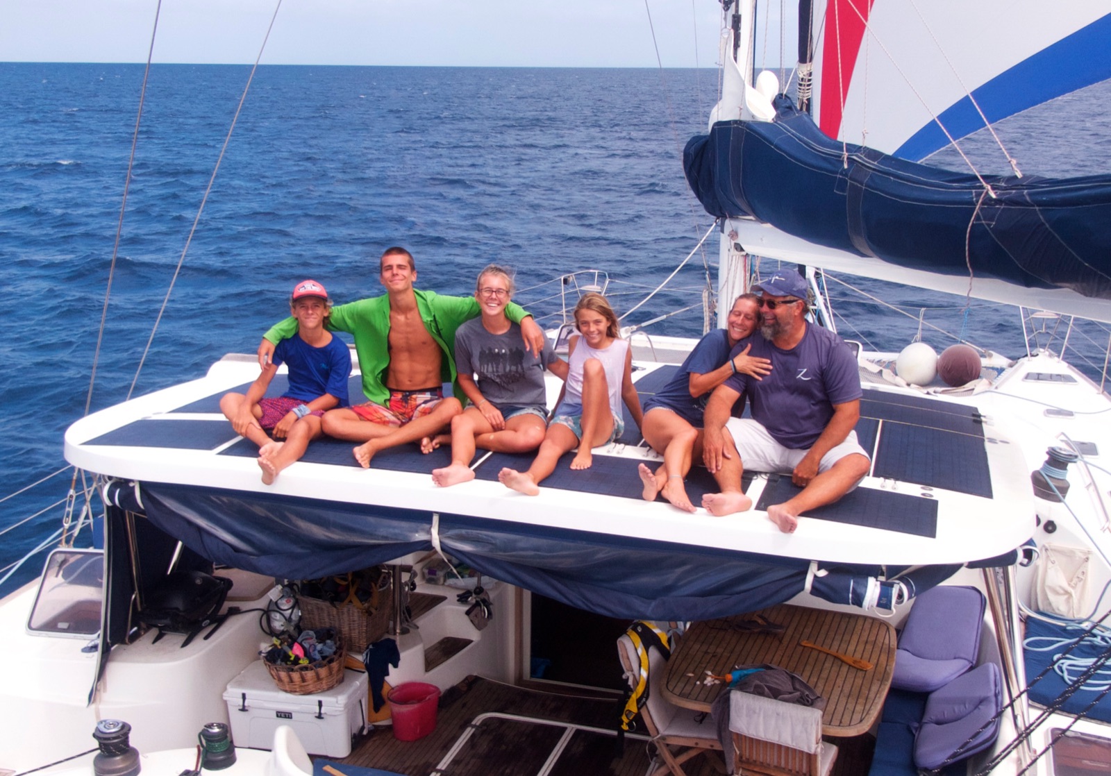 The family relaxing on the trampoline at sea